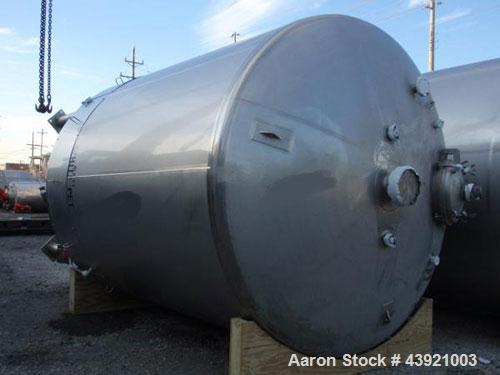 Used 31000 liter(8190 gallon) Apache storage tank, 304 stainless steel construction, 120" inner diameter x 149"  straight side, dish top and bottom, 24" manway, 8", (5)3"  top ports, 3" center bottom...