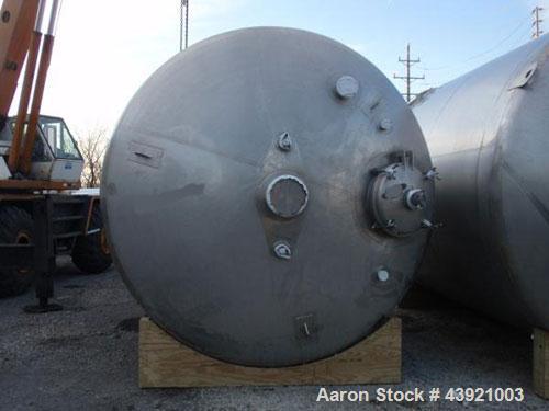 Used 31000 liter(8190 gallon) Apache storage tank, 304 stainless steel construction, 120" inner diameter x 149"  straight side, dish top and bottom, 24" manway, 8", (5)3"  top ports, 3" center bottom...