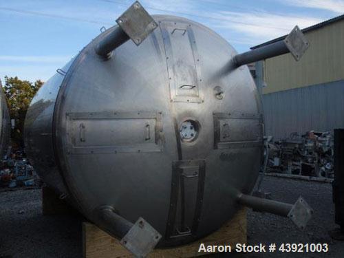 Used 31000 liter(8190 gallon) Apache storage tank, 304 stainless steel construction, 120" inner diameter x 149"  straight side, dish top and bottom, 24" manway, 8", (5)3"  top ports, 3" center bottom...