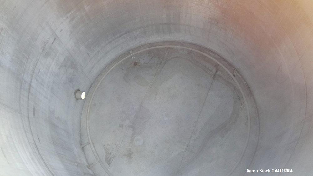 Used Blaw Knox Tank, 11,800 Gallon, 304 Stainless Steel, Vertical. Approximate 144” diameter x 168” straight side, dished top, flat bottom. (1) Turn of internal pipe coil on bottom. Openings top 1” (...