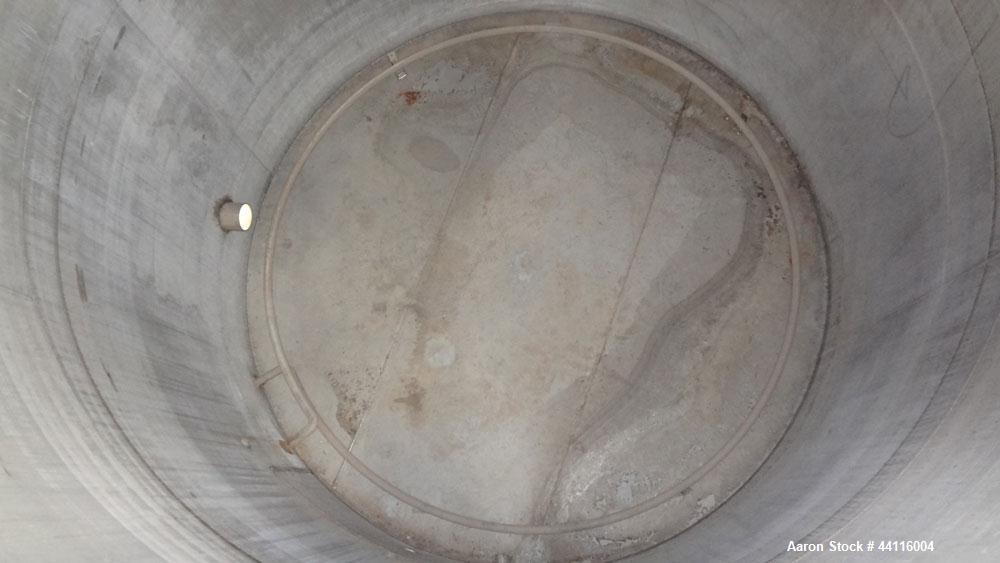Used Blaw Knox Tank, 11,800 Gallon, 304 Stainless Steel, Vertical. Approximate 144” diameter x 168” straight side, dished top, flat bottom. (1) Turn of internal pipe coil on bottom. Openings top 1” (...