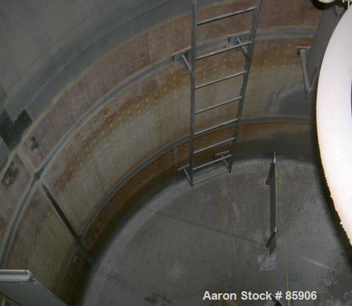 USED: Bishopric Products Co jacketed tank, 12,000 gallon, 304 stainless steel, vertical. 12'6" diameter x 12' straight side. Dish top, coned bottom. Dimple jacket on 7' bottom side wall and bottom co...