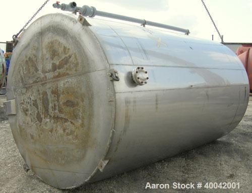 Used: C.E. Howard Tank, 5000 Gallon, 304 Stainless Steel, Vertical.  94" diameter x 165" straight side.  Dish top, flat bott...