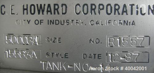 Used: C.E. Howard Tank, 5000 Gallon, 304 Stainless Steel, Vertical.  94" diameter x 165" straight side.  Dish top, flat bott...