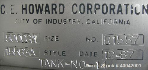 Used: C.E. Howard Tank, 5000 Gallon, 304 Stainless Steel, Vertical.  94" diameter x 165" straight side.  Dish top, flat bottom.  16" x 20" side oval manway with cover.  Top Openings:  8" flange, 6", ...
