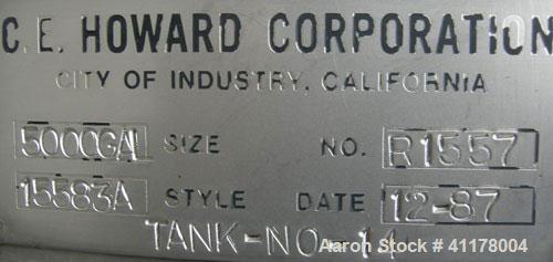 Used Used C.E. Howard Tank, 5000 Gallon, 304 Stainless Steel, Vertical. 94"
diameter x 165" straight side, dish top, sloped bottom. Openings: top 8", (2) 6", 10"; side 16" x 20" bottom oval manway wi...