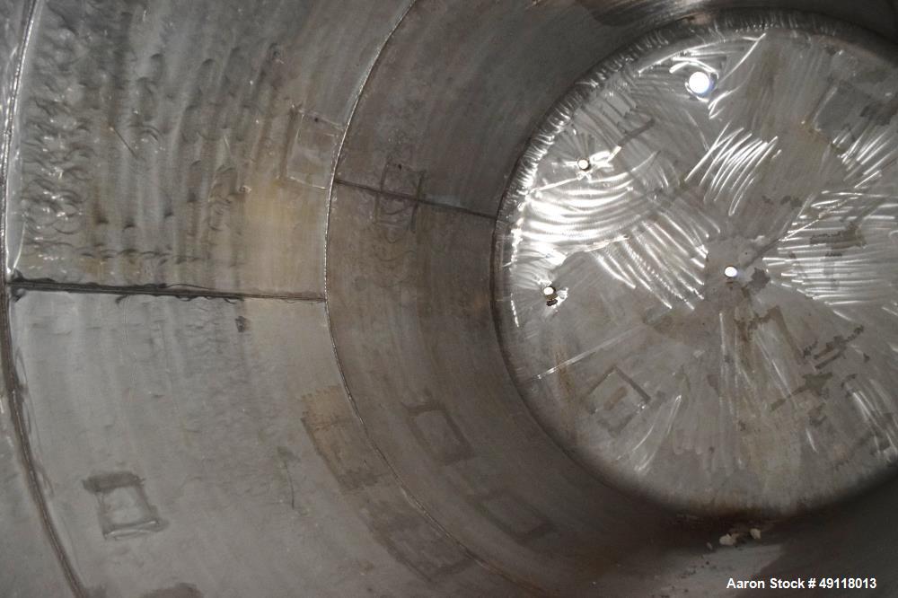 Unused- Central Fabricators Tank, 8,000 Gallon, Stainless Steel, Vertical. Approximate 114" diameter x 178" straight side, dished top & bottom. Openings top (3) 2", 3", 4", side (2) 2", 24" man way w...