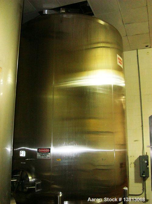 Used Cherry Burrell 6,000 Gallon Vertical Storage Tank. 9'3" diameter x 11'6" straight side, 15'6" overall height. 6 Stainless steel legs, dished heads, 3" tri-clamp CBO, 16-1/2" discharge height, si...