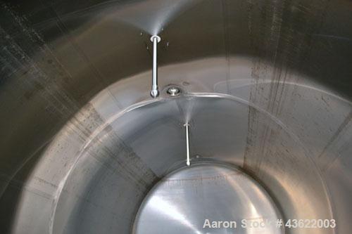 Used Cherry-Burrell Type C Tank, 6,000 Gallon, Model CH, 304 Stainless Steel, Horizontal. 96” Diameter x 184” straight side, dished heads. Top entering agitator with a 1” diameter shaft with (4) padd...