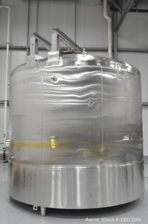 Used Cherry Burrell 6,000 Gallon Top Agitated Mixing Tank, Model CV.  Top agitated stainless steel single wall mixing tank with top agitator (missing shaft and propeller).  Includes dual CIP spray ba...