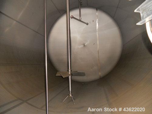 Used Cherry Burrell 10,000 Gallon Stainless Steel Horizontal Storage Tank. Approximately 10'6" diameter x 14'6" straight side. Dished heads. 16" x 20" side oval manway with cover. 3" EBO. (2) Dual CI...
