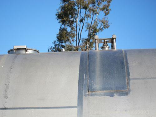 Used Cherry Burrell 10,000 Gallon Stainless Steel Horizontal Storage Tank. Approximately 10'6" diameter x 14'6" straight side. Dished heads. 16" x 20" side oval manway with cover. 3" EBO. (2) Dual CI...