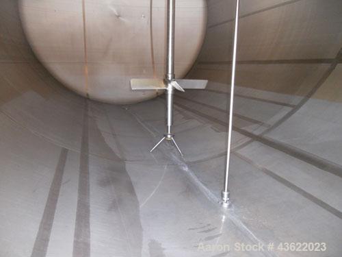 Used Cherry Burrell 10,000 Gallon Stainless Steel Horizontal Storage Tank. Approximately 10'6" diameter x 14'6" straight side. Dished heads. 16" x 20" side oval manway with cover. 3" EBO. (2) Dual CI...