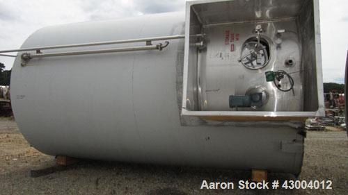 Used Cherry-Burrell Tank, 9000 Gallon, Model SVW, Stainless Steel, Vertical. Dished top, flat bottom. Jacketed on side bottom. Side bottom mounted prop style agitator, side bottom man way. Insulated ...