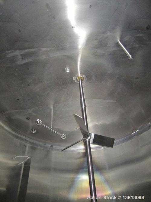 Used Cherry Burrell 8000 Gallon Vertical Stainless Steel Tank.Side mounted 5 hp agitator, side manway, sightglass, 12' diameter x 8'6" straight wall, 13'2" overall height, 12'6" shipping width (based...