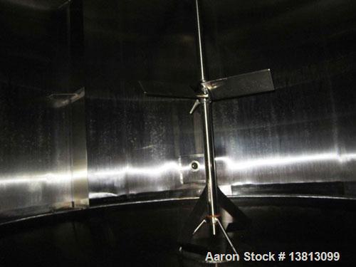 Used Cherry Burrell 8000 Gallon Vertical Stainless Steel Tank.Side mounted 5 hp agitator, side manway, sightglass, 12' diameter x 8'6" straight wall, 13'2" overall height, 12'6" shipping width (based...