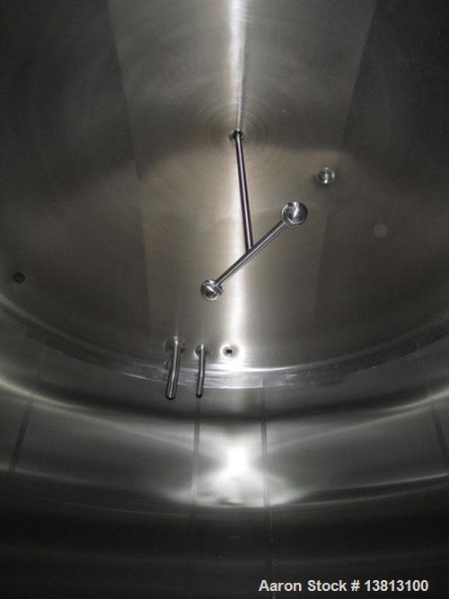 Used Cherry Burrell 8000 Gallon Vertical Stainless Steel Tank.Side mounted 5 hp agitator, side manway, sightglass, 12' diameter x 8'6" straight wall, 13'2" overall height, 12'6" shipping width (based...