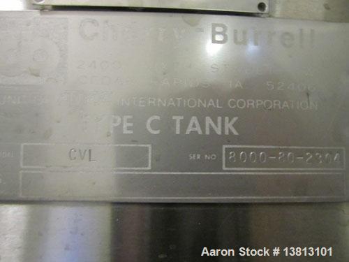 Used Cherry Burrell 8000 Gallon Vertical Stainless Steel Tank.Top mounted agitator, dual impeller, bearing block, side manway, sightglass, 3" center bottom discharge, 12'9" overall width x 10'10" str...
