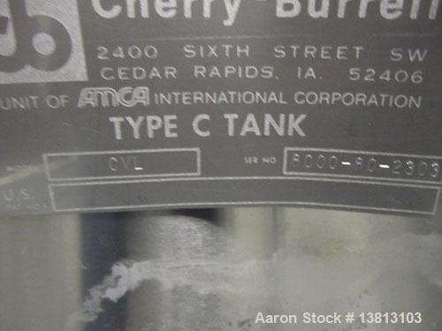 Used Cherry Burrell 8000 Gallon Vertical Stainless Steel Tank.Top mounted agitator, dual impeller, bearing block, side manway, sightglass, 3" center bottom discharge, 12'9" overall width x 10'10" str...