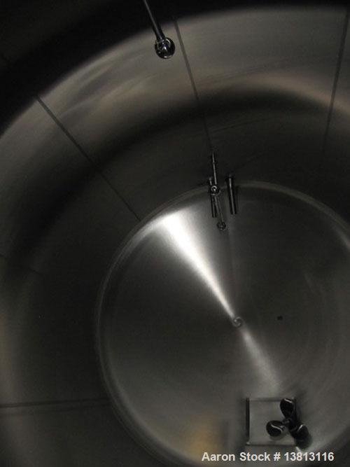 Used Cherry Burrell 8,000 Gallon Horizontal Stainless Steel Tank.  End mount agitator approximately 5 hp.  Manway with cover, sight glass, 8 legs.  Approximately 10' diameter x 12' straight side, 17'...