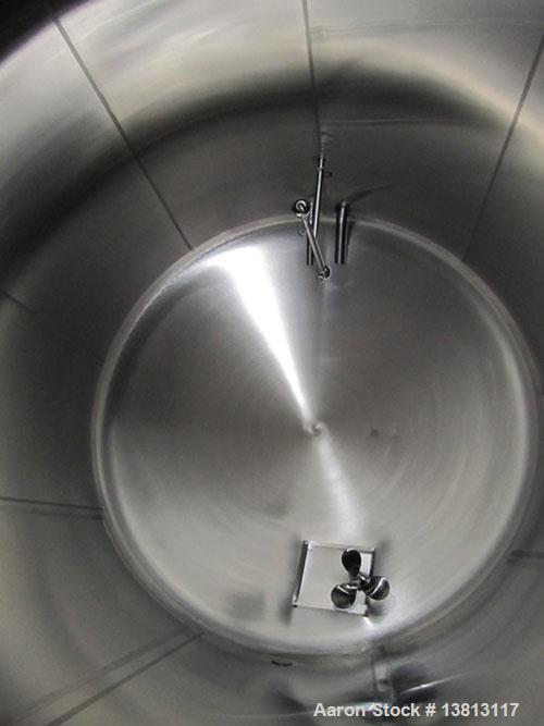 Used Cherry Burrell 8,000 Gallon Horizontal Stainless Steel Tank.  End mount agitator approximately 5 hp.  Manway with cover, sight glass, 8 legs.  Approximately 10' diameter x 12' straight side, 17'...