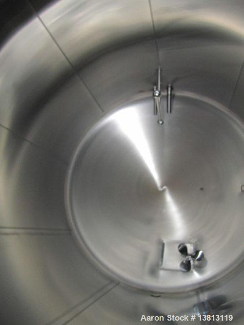 Used Cherry Burrell 8,000 Gallon Horizontal Stainless Steel Tank.  End mount agitator approximately 5 hp.  Manway with cover, sight glass, 8 legs.  Approximately 10' diameter x 12' straight side, 17'...