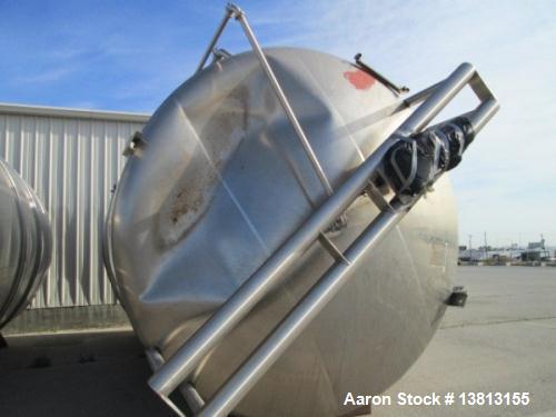 Used- Cherry Burell 15,000 Gallon, Vertical, All Stainless Steel Tank. Has top mounted agitator, flat bottom, dish top (dent...