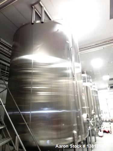 Used Cherry Burrell 6,000 Gallon Top Agitated Tank. Top mounted agitator vertical single wall stainless steel tank. 9'-6" diameter x 11'-6" straight wall x 18'-6" overall height. Side man way. (6) SS...