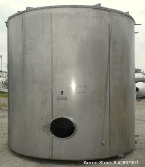 Used Cherry-Burrell Tri-Canada Tank, 6000 Imperial Gallons (7205 U.S. Gallons), 304 Stainless Steel, Vertical. Approximately 128" diameter x 118" straight side. Flat top, sloped bottom. 1-1/4" Diamet...