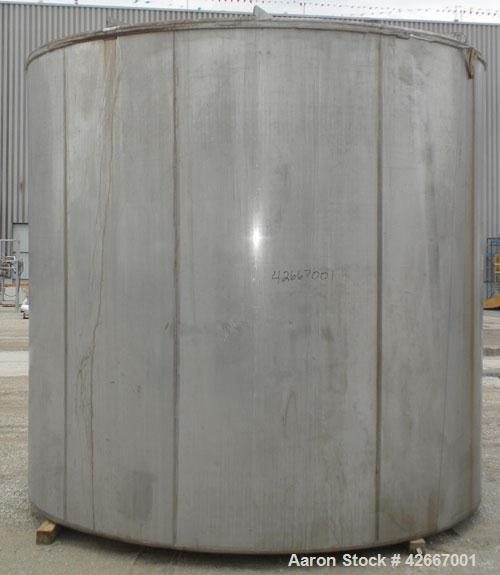 Used Cherry-Burrell Tri-Canada Tank, 6000 Imperial Gallons (7205 U.S. Gallons), 304 Stainless Steel, Vertical. Approximately 128" diameter x 118" straight side. Flat top, sloped bottom. 1-1/4" Diamet...