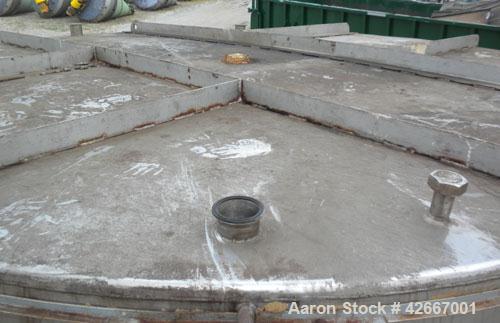 Used Cherry-Burrell Tri-Canada Tank, 6000 Imperial Gallons (7205 U.S. Gallons), 304 Stainless Steel, Vertical. Approximately 128" diameter x 118" straight side. Flat top, sloped bottom. 1-1/4" Diamet...