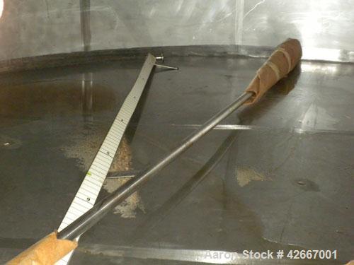 Used Cherry-Burrell Tri-Canada Tank, 6000 Imperial Gallons (7205 U.S. Gallons), 304 Stainless Steel, Vertical. Approximately 128" diameter x 118" straight side. Flat top, sloped bottom. 1-1/4" Diamet...