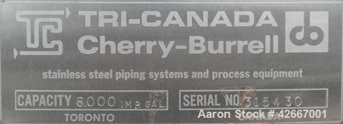 Used Cherry-Burrell Tri-Canada Tank, 6000 Imperial Gallons (7205 U.S. Gallons), 304 Stainless Steel, Vertical. Approximately 128" diameter x 118" straight side. Flat top, sloped bottom. 1-1/4" Diamet...