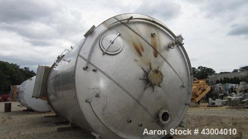 Used Cherry-Burrell Tank, 7500 Gallon, Stainless Steel, Vertical. Approximate 128" diameter x 13' straight side, dished top, flat bottom. Bottom head jacketed. 18" top manway, 3" center bottom outlet...