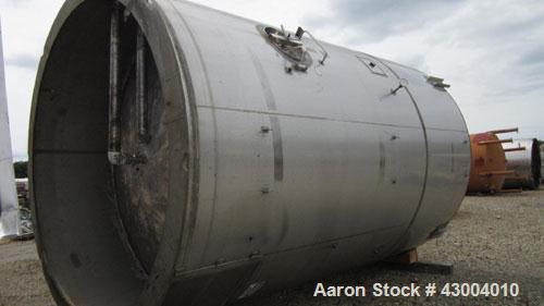 Used Cherry-Burrell Tank, 7500 Gallon, Stainless Steel, Vertical. Approximate 128" diameter x 13' straight side, dished top, flat bottom. Bottom head jacketed. 18" top manway, 3" center bottom outlet...