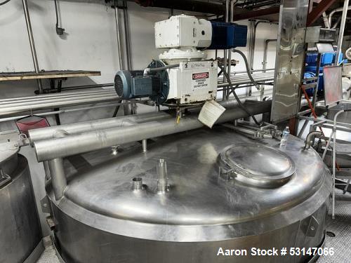 Used 6,000 Gallon 316 Stainless Steel Jacketed & Double Motion Agitated Tank with scraper agitation and center agitation with turbine blade paddles. Jacket rated for 100 PSI at 350 degrees Fahrenheit...