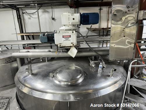 Used 6,000 Gallon 316 Stainless Steel Jacketed & Double Motion Agitated Tank with scraper agitation and center agitation with turbine blade paddles. Jacket rated for 100 PSI at 350 degrees Fahrenheit...
