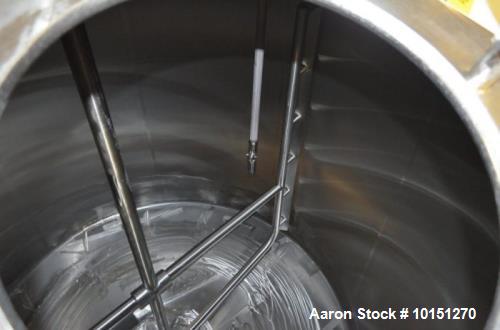 Used Crepaco 6,000 Gallon (Approximately) Vertical Stainless Steel Single Wall Tank. Dome top, dished bottom center. Bridge mounted agitator. 10 hp motor. Sweep agitator. Internal baffles. Spray ball...