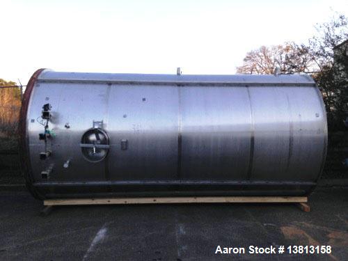 Used 6,000 Gallon Stainless Steel Storage Tank. Approximately 98'' diameter x 16' straight wall, side manhole. Inlets 2 - 3'' threaded 2 - 1.5'' threaded. Outlets 3'' threaded.