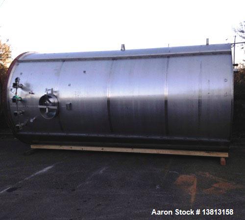 Used 6,000 Gallon Stainless Steel Storage Tank. Approximately 98'' diameter x 16' straight wall, side manhole. Inlets 2 - 3'' threaded 2 - 1.5'' threaded. Outlets 3'' threaded.