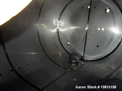 Used 6,000 Gallon Stainless Steel Storage Tank. Approximately 98'' diameter x 16' straight wall, side manhole. Inlets 2 - 3'' threaded 2 - 1.5'' threaded. Outlets 3'' threaded.