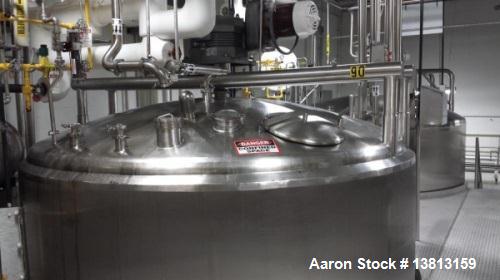 Used Crepaco 6000 Gallon Jacketed Tank with Scrape Agitation. Stainless steel cone bottom tank. Sweep scrape agitated, driven by a 5 HP Motor.  Jacket rated 158 PSI at 100 degrees F. Approximate ship...