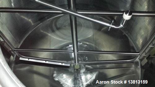 Used Crepaco 6000 Gallon Jacketed Tank with Scrape Agitation. Stainless steel cone bottom tank. Sweep scrape agitated, driven by a 5 HP Motor.  Jacket rated 158 PSI at 100 degrees F. Approximate ship...