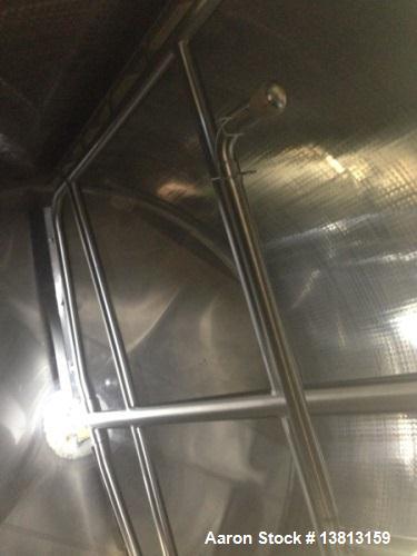 Used Crepaco 6000 Gallon Jacketed Tank with Scrape Agitation. Stainless steel cone bottom tank. Sweep scrape agitated, driven by a 5 HP Motor.  Jacket rated 158 PSI at 100 degrees F. Approximate ship...
