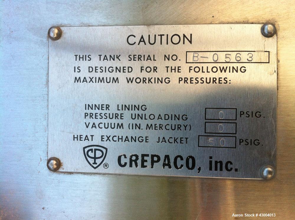 Used Crepaco Tank, 9000 Gallon, 304 Stainless Steel, Vertical. Dished top, flat bottom. Jacketed on side bottom. Side bottom mounted prop style agitator, side bottom man way. Insulated with carbon st...