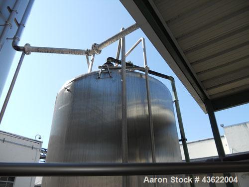 Used Crepaco Approximately 4750 Gallon Stainless Steel Tank. Approximately 106" diameter x 9'6" straight side. Dished heads. 16" x 20" oval side manway with cover. 3" threaded CBO. (2) CIP spray ball...