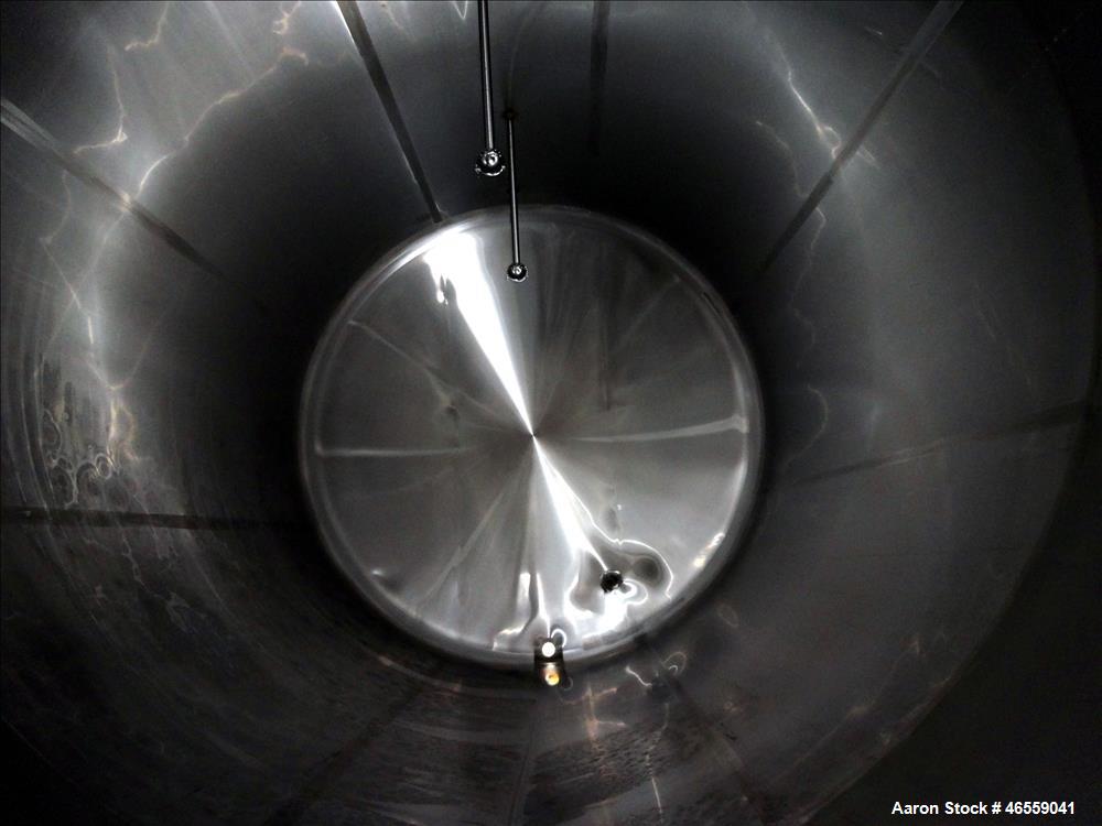 Used Crepaco Industries Tank, Approximately 10,000 gallon, 304 Stainless Steel, Horizontal. Approximate 124" diameter x 196" straight side. Dished heads. Openings: 20" x 16" oval manway with cover. T...
