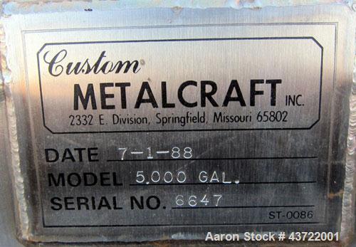 Used- Custom Metalcraft Tank, 5000 Gallon, 304 Stainless Steel, Horizontal. Approximately 96” diameter x 144” straight side,...