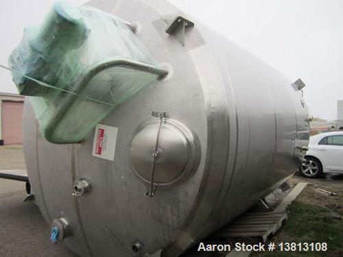 Used DCI Insulated Stainless Steel Mixing Tank, 6,000 Gallon.  Top agitated, flat bottom, stainless steel, top manway and 1 spray ball.  4 Top inlets:  (2) 5", (1) 8", (1) 2";  3 outlets:  2.5", 3" a...