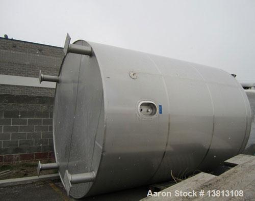 Used DCI Insulated Stainless Steel Mixing Tank, 6,000 Gallon.  Top agitated, flat bottom, stainless steel, top manway and 1 spray ball.  4 Top inlets:  (2) 5", (1) 8", (1) 2";  3 outlets:  2.5", 3" a...